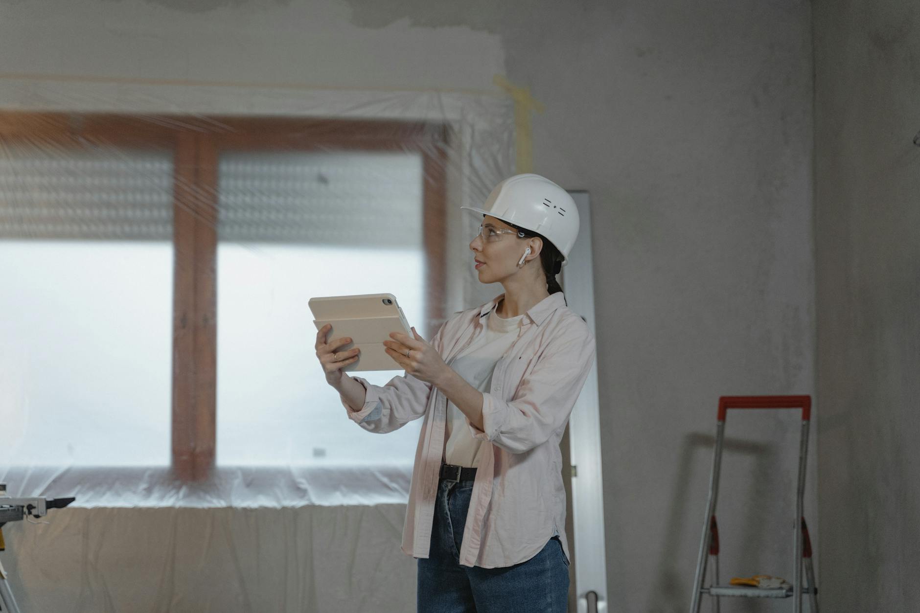 Construction site with modern technology tools and digital project management