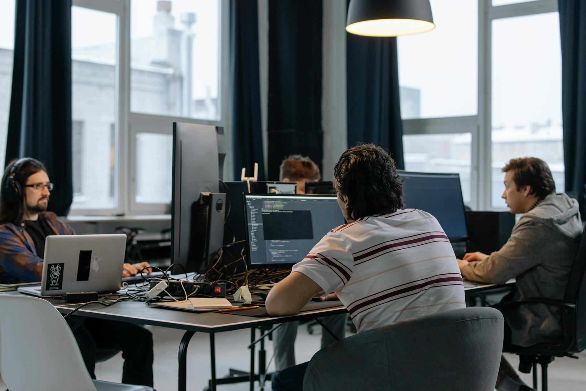 Software development team collaborating on code and technology solutions