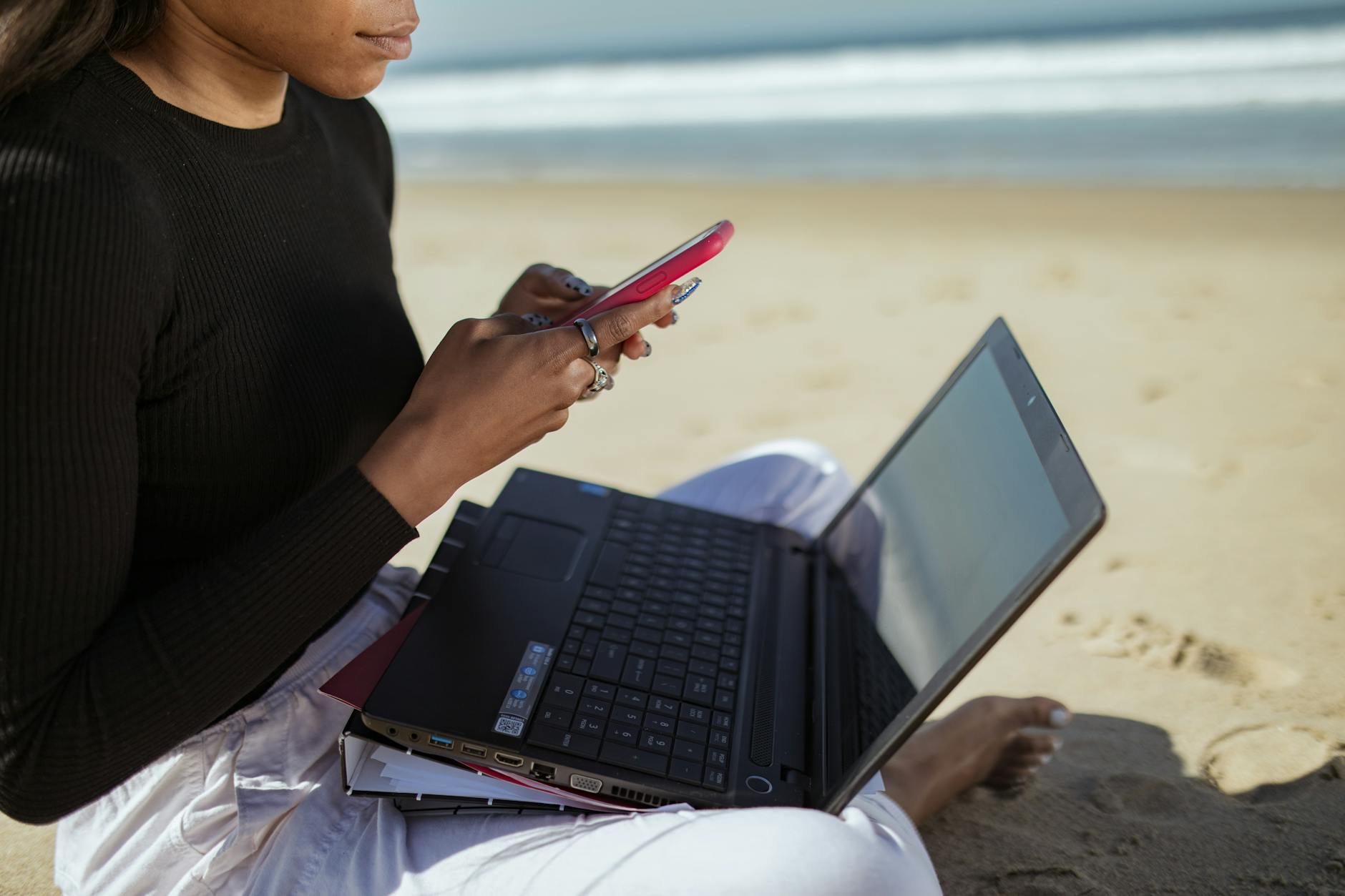 Professional using laptop computer in outdoor or remote location