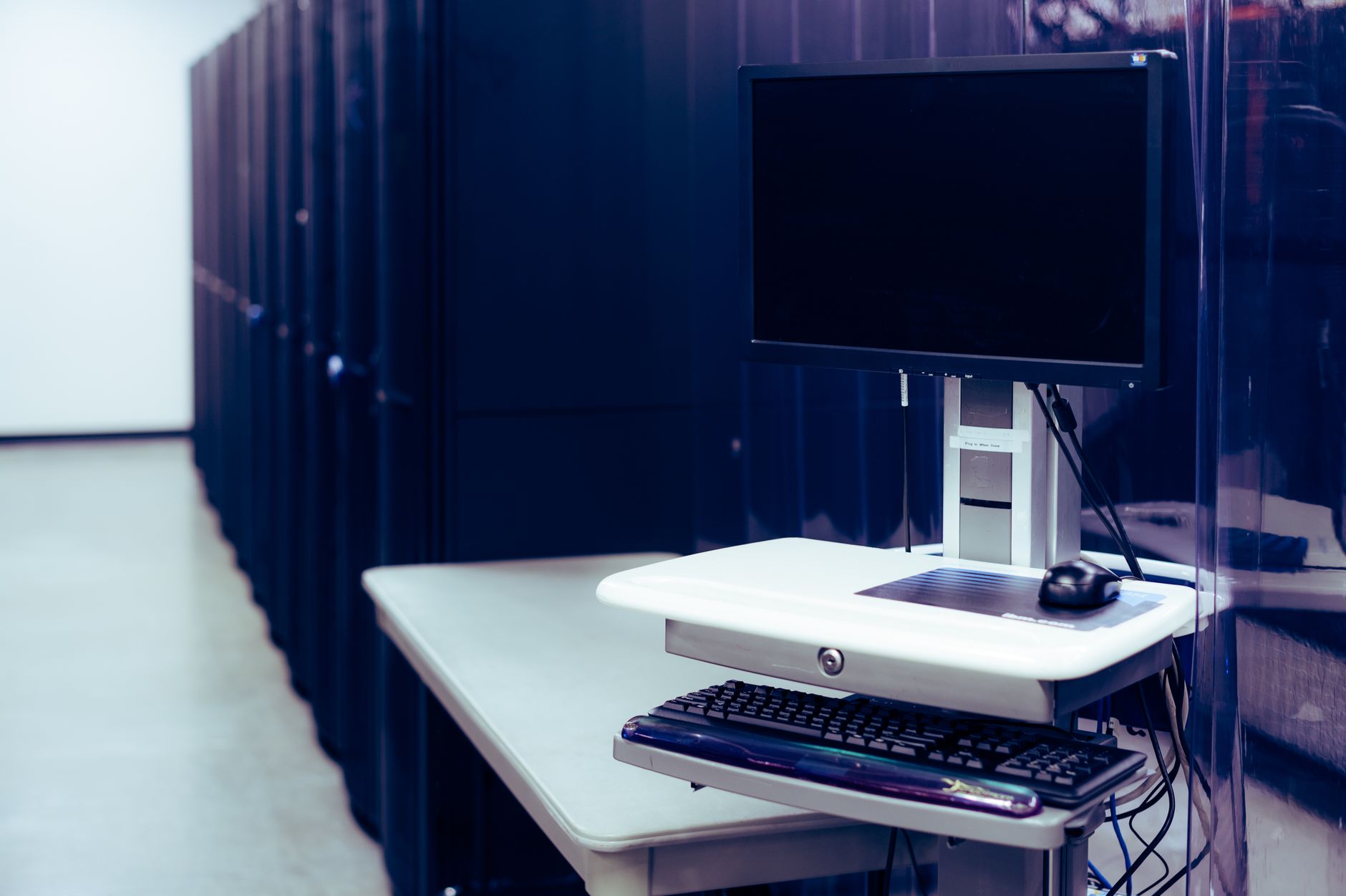 Local AI server setup with multiple monitors displaying LLM interfaces