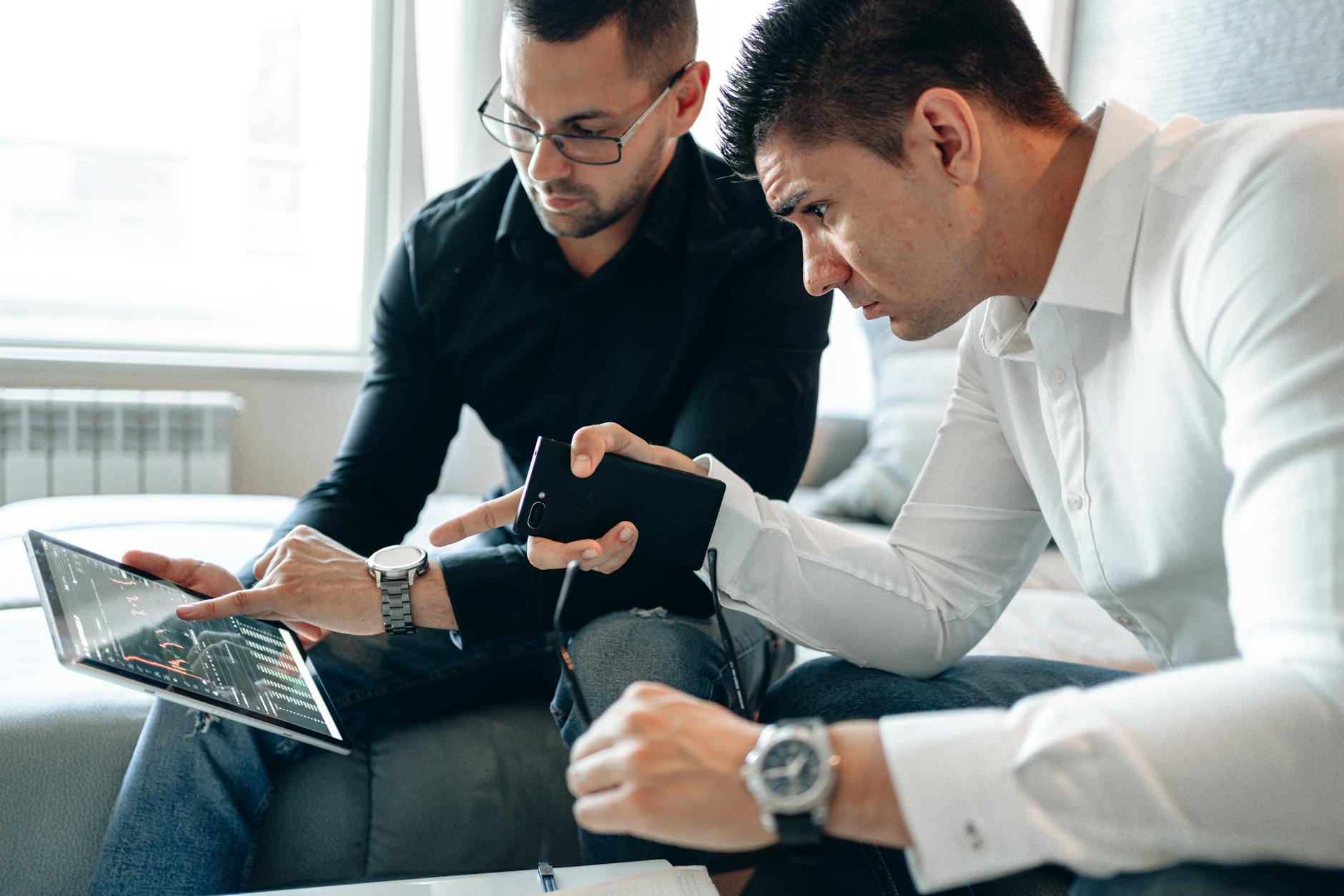 Business professionals collaborating on digital strategy with modern technology tools