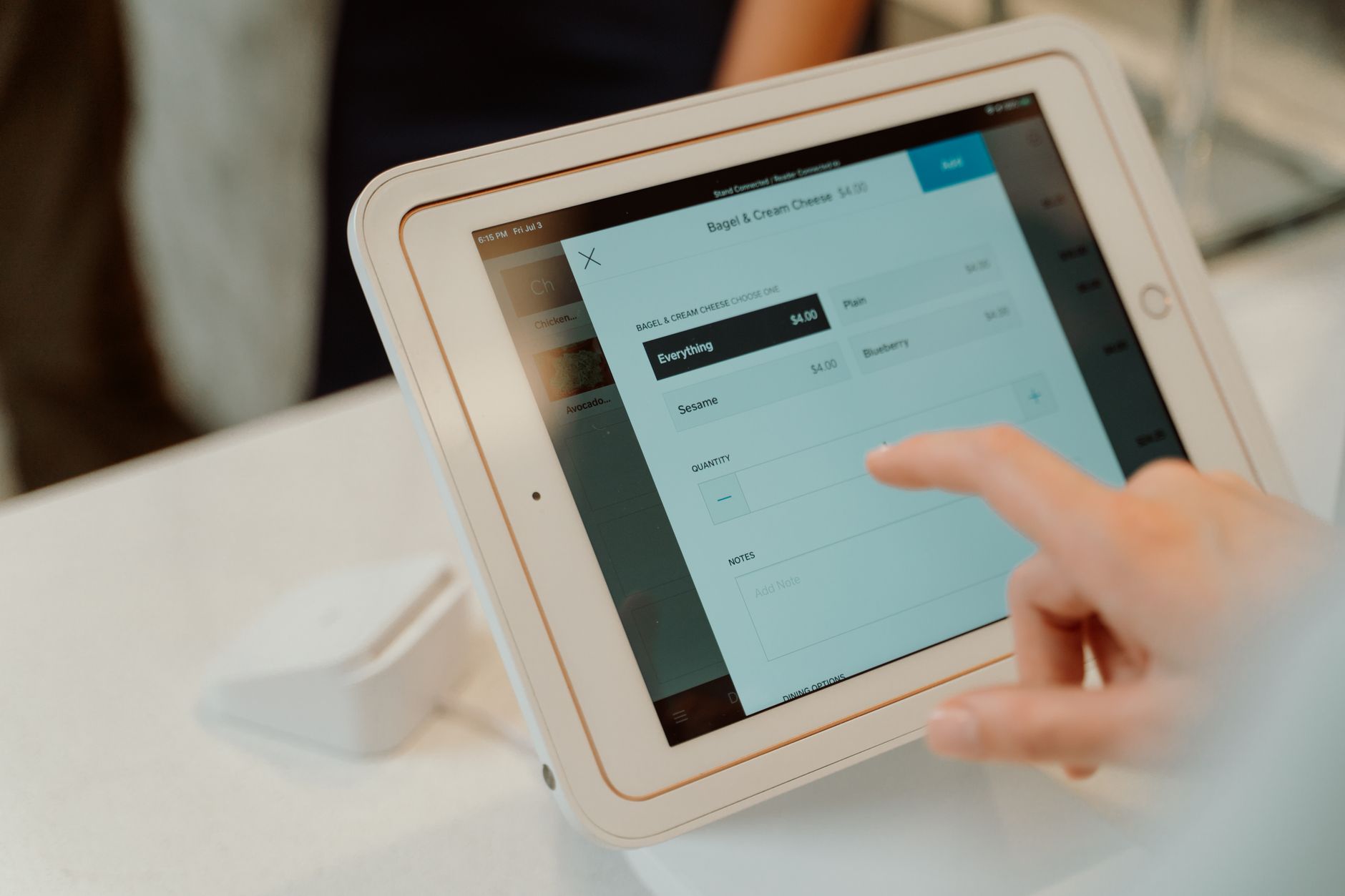 Modern point of sale system with tablet and payment terminal in retail store