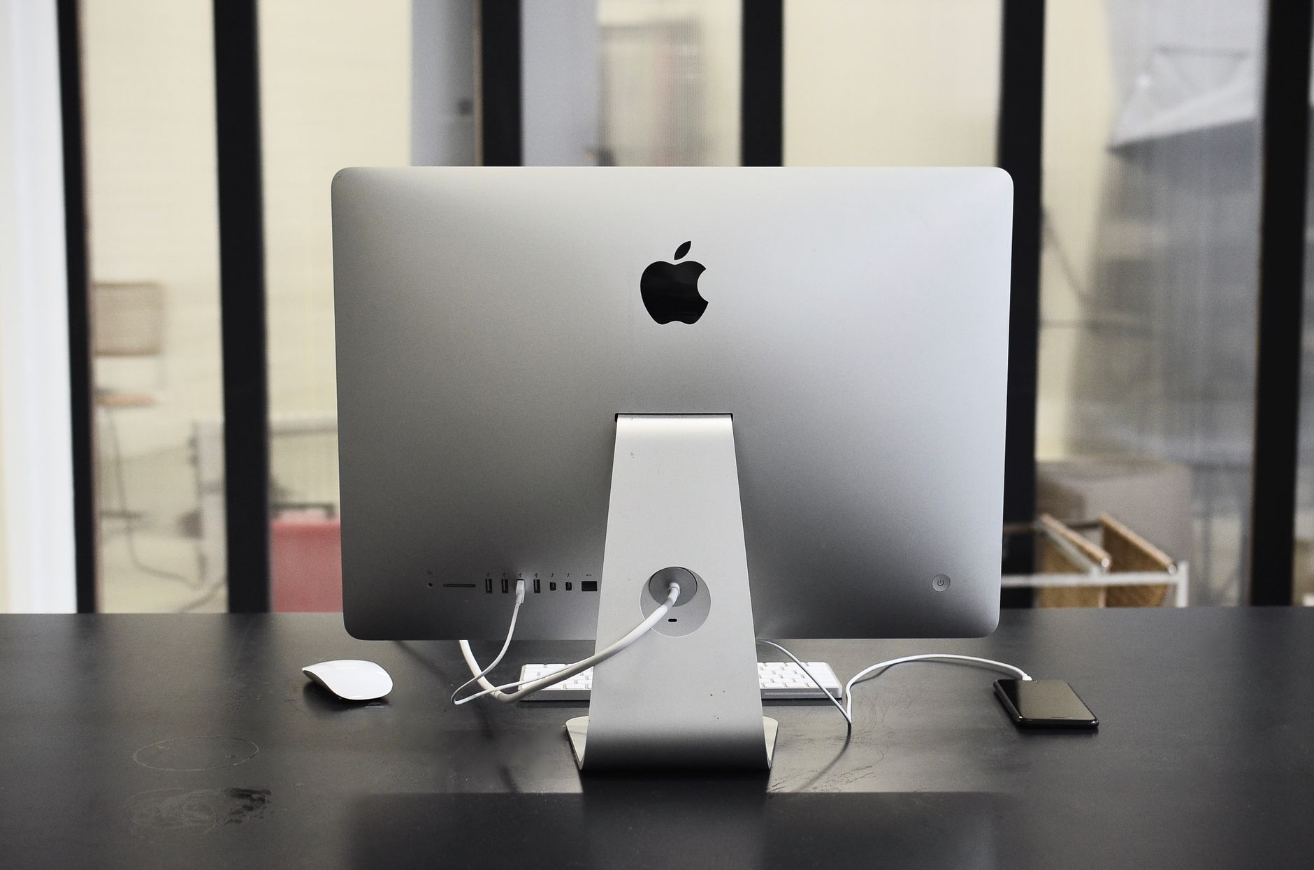 Professional using desktop computer in modern office environment